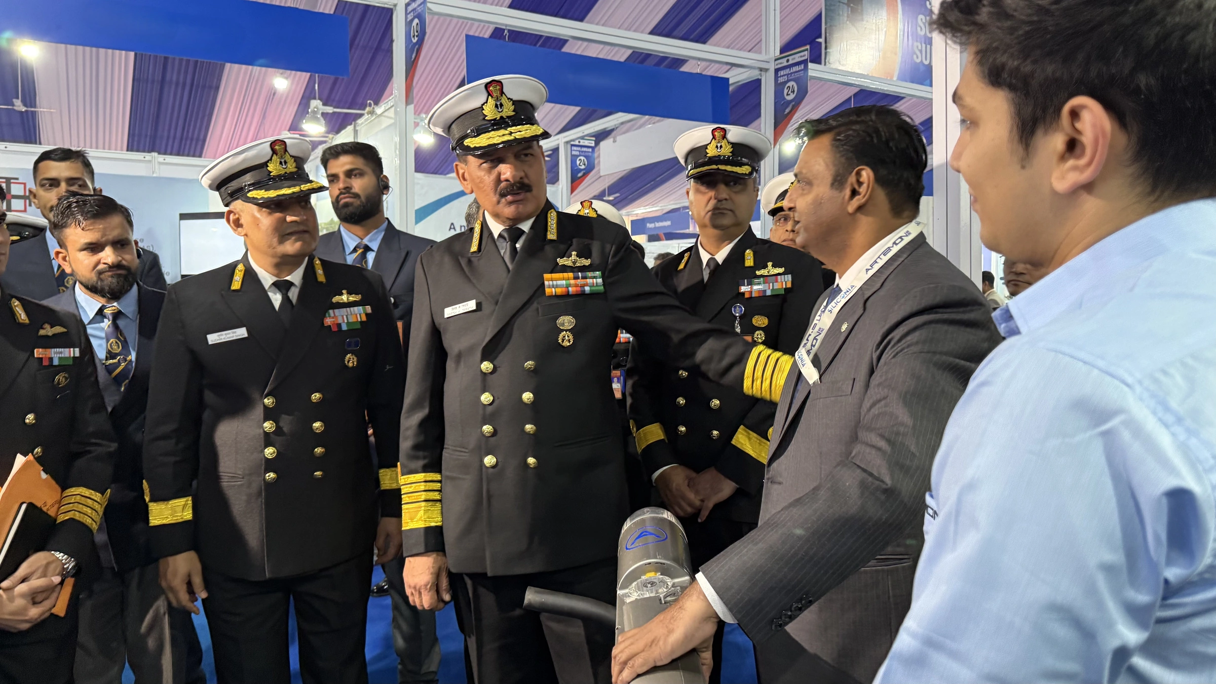 Artemon team discussing its UAV platform with naval representatives at an exhibition