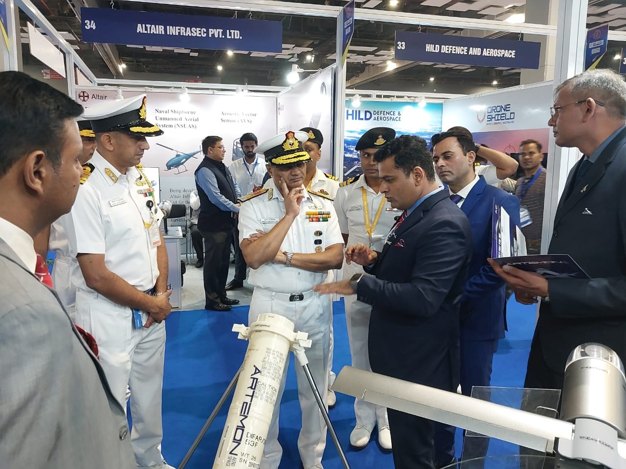 Artemon representatives briefing Indian Navy visitors on the loitering UAV and launcher